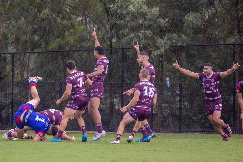 The Sea Eagles celebrate the try of Jamie Humphreys to take the lead.