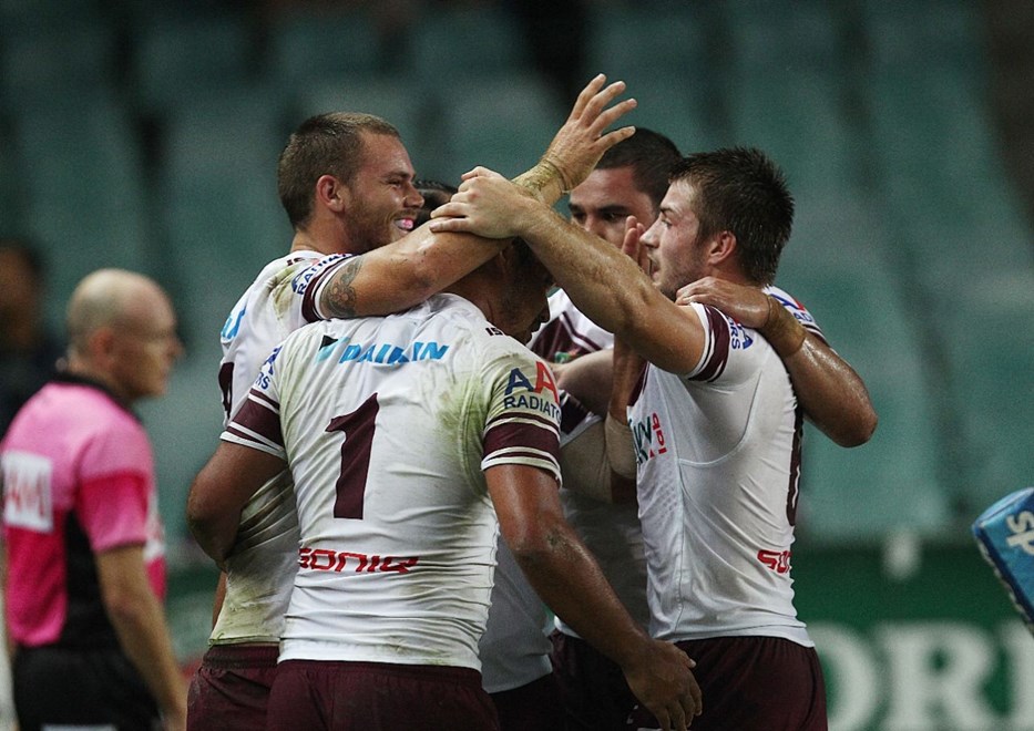 Photo by Colin Whelan copyright © nrlphotos.com :   Manly celebrate the try to Chayse Blair at left     NRL Rugby League, Telstra Cup Round 4 Sydney Roosters v Manly Warringah Sea Eagles at SFS, Friday March 28th  2014.