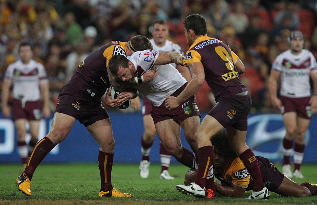 Brenton Lawrence brought down by Josh McGuire, Sam Thaiday and Andrew McCullough:	NRL Rugby League, Round 1 2013, Brisbane Broncos v Manly Sea Eagles at Suncorp Stadium, Friday March 8th 2013. Digital image by Colin Whelan © nrlphotos.com