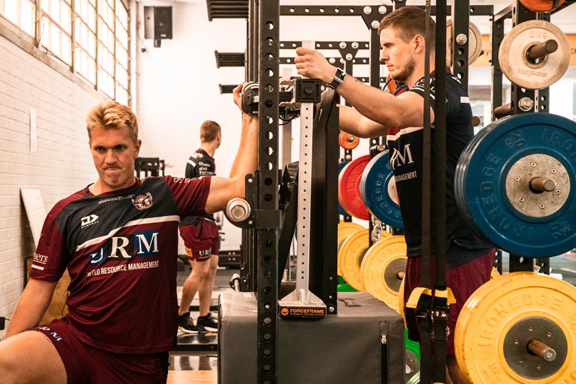 Strength and Conditioning Coach Conor Daly puts Ben Trbojevic through a shoulder strength test. 