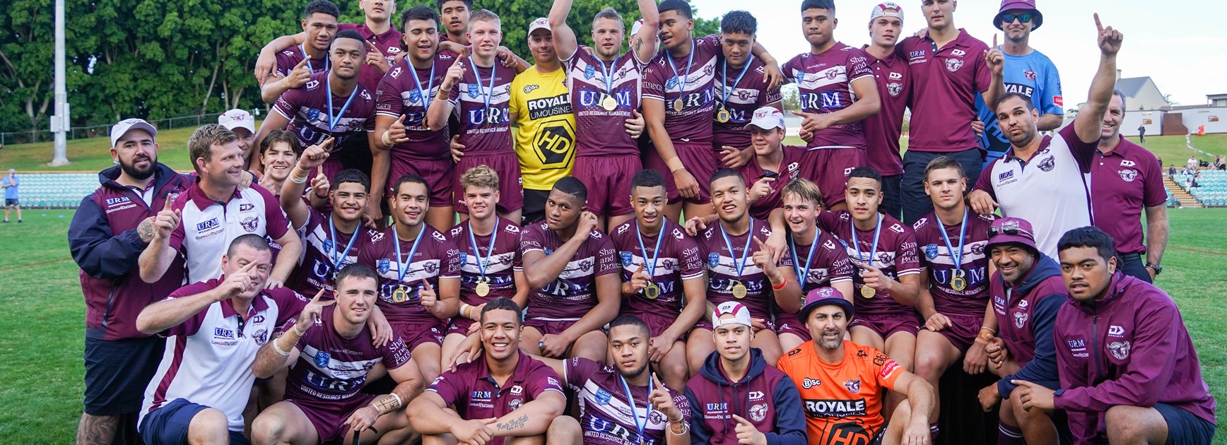 Premiers...Manly players and officials celebrate their superb season