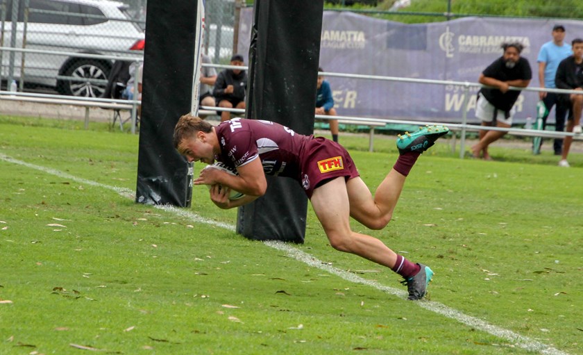 Manly captain and centre Josh Feledy goes over for a try