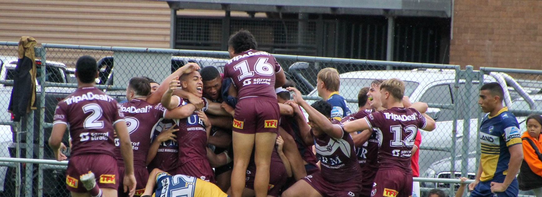 The Manly boys celebrate the match-winning try to Lehi Hopoate