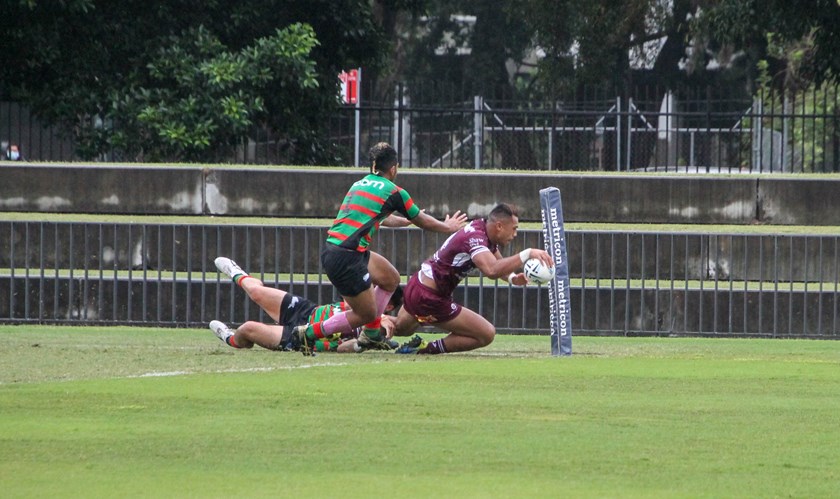 Simon Tito dives over for a try against Souths.
