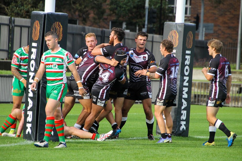 Blacktown Workers celebrate the try to James Roumanos