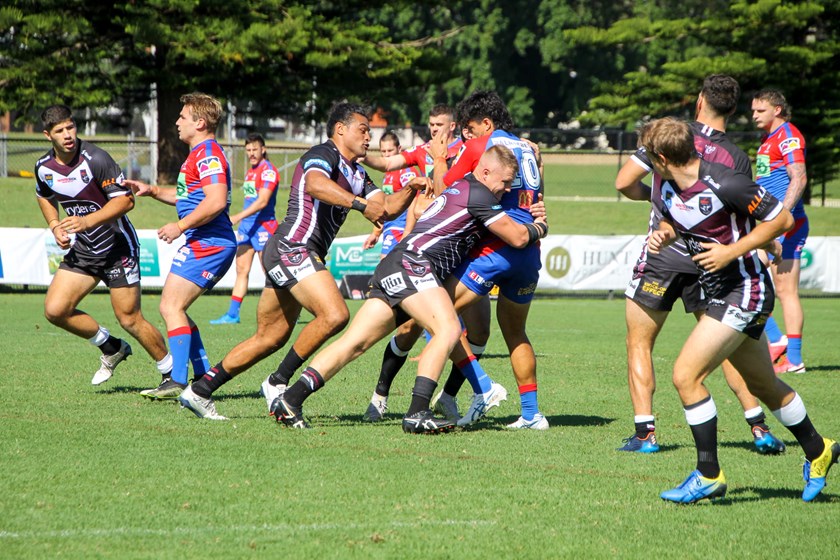 Great D....Kurt Der Luis drives back a Knights player.