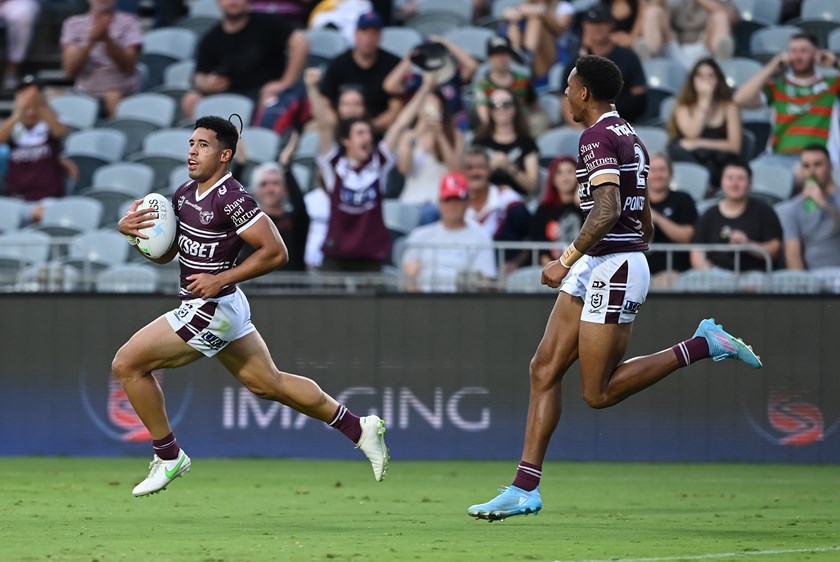 Cruise control...Tolu Koula strolls to the tryline to the delight of Jason Saab