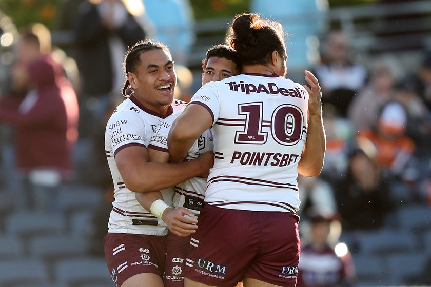 Brothers in arms....Tolu Koula celebrates his first NRL try with his cousin Christian Tuipulotu (left) and Toff Sipley
