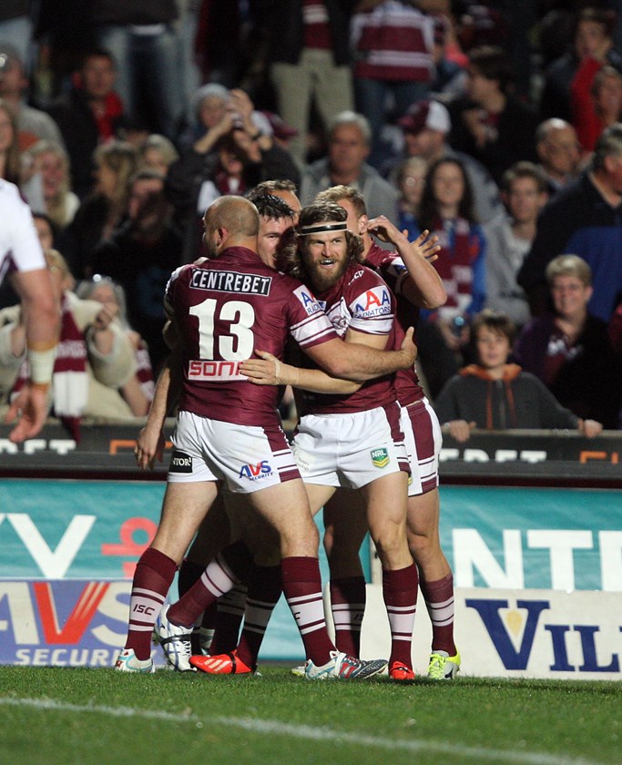 A great night for the 'Wolfman'....the Sea Eagles celebrate one of his three tries