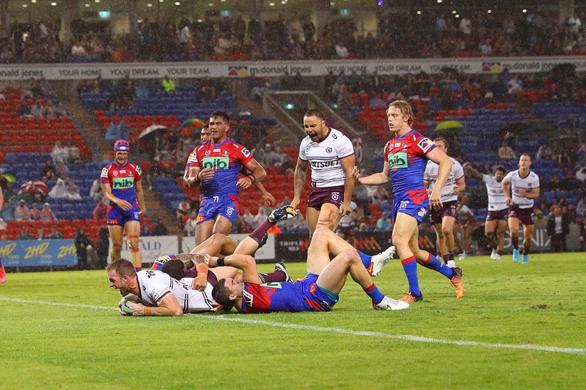 The elation...Andrew Davey dives over for his first NRL try.