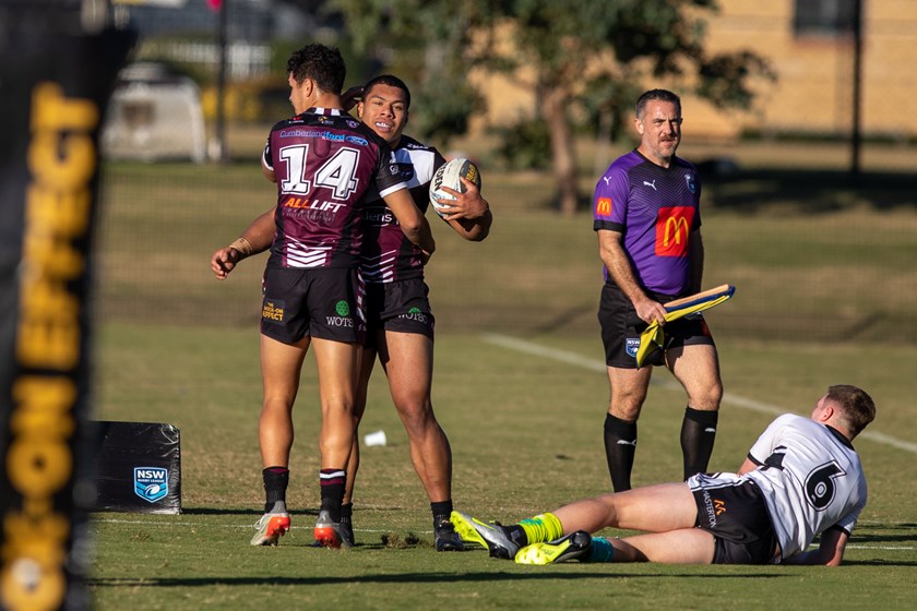 Nice work...Raymond Tuaimalo Vaega celebrates his try with centre Clayton Faulalo
