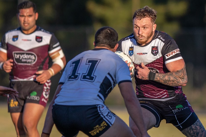 Charging bull...Prop Austin Dias takes on the Magpies