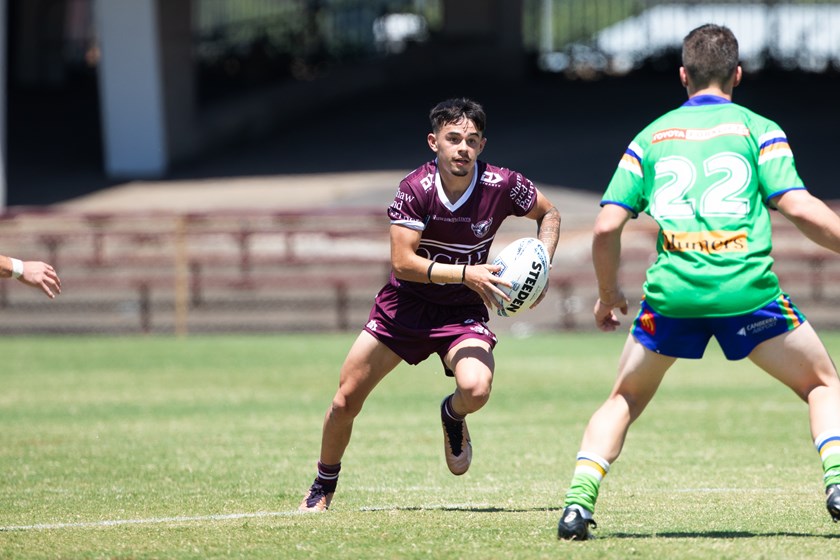Taking him on...Joshua Weightman scored two tries for the Sea Eagles
