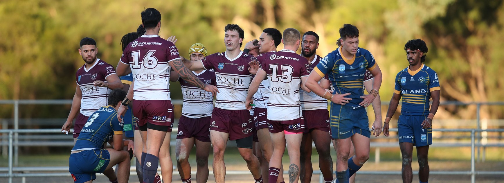 The Sea Eagles celebrate a try in their impressive win over the Eels. 
