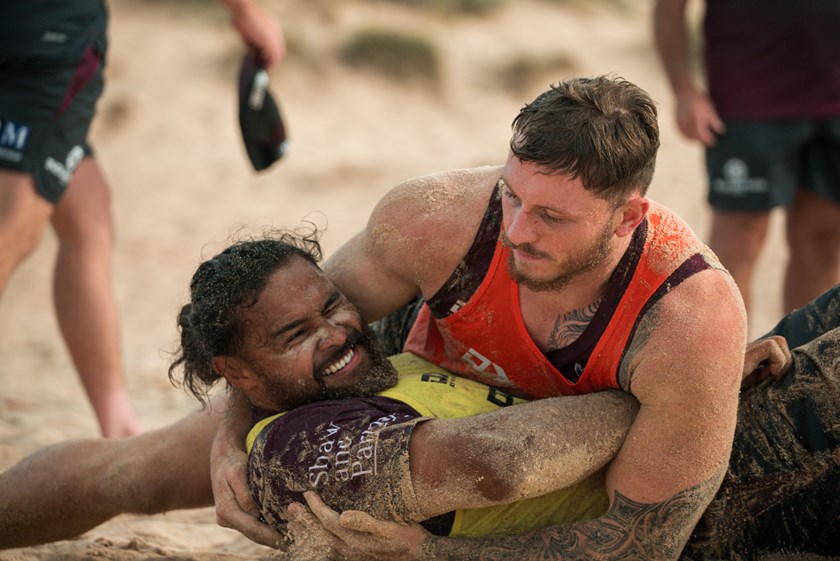 Tough session...Toff Sipley and team-mate Austin Dias undergo some tackling work at Long Reef Beach