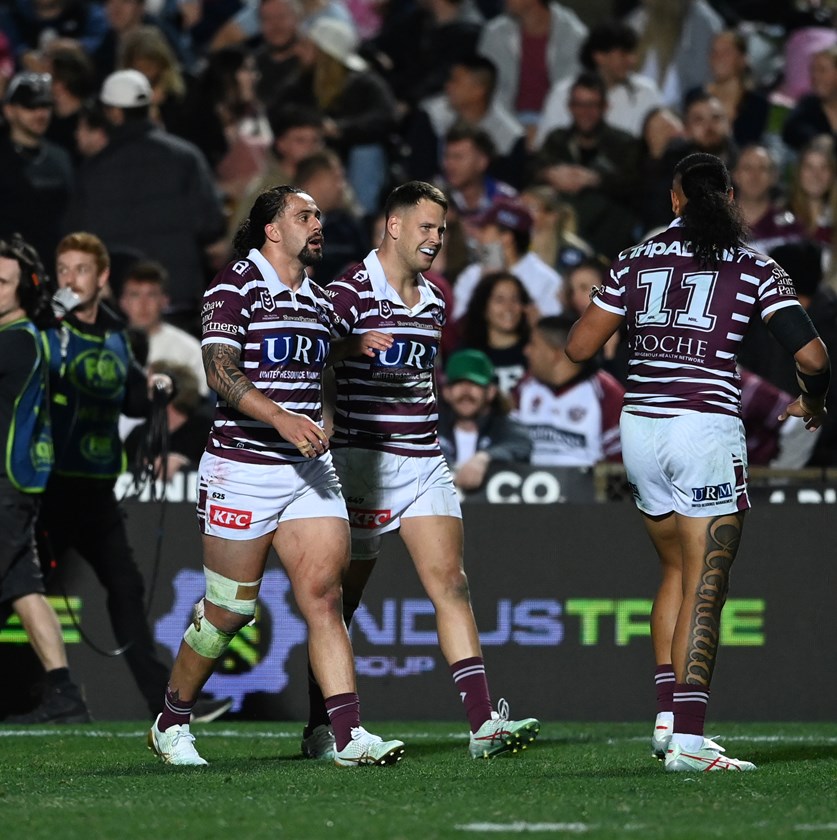 Dream come true...Dean Matterson celebrates his NRL debut with a try.