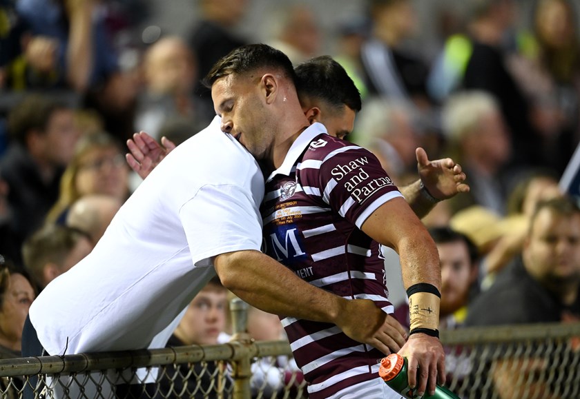 Brothers in arms...Ryan Matterson embraces his brother Dean after leaving the field  following his NRL try