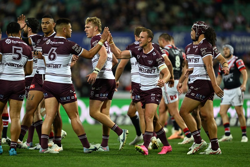 The Sea Eagles celebrate the try to Josh Schuster