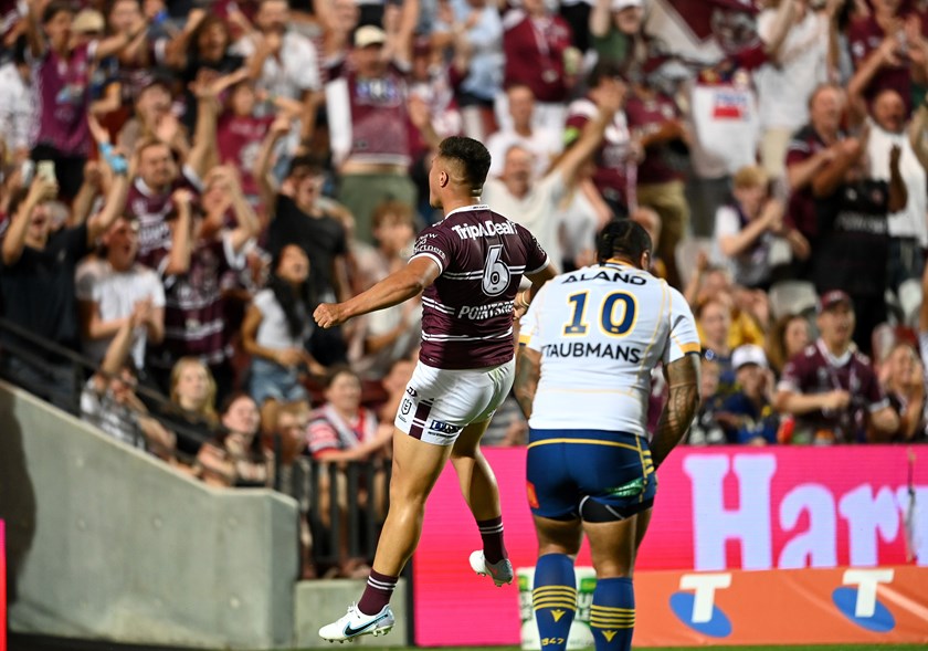 Happy in the 6...Josh Schuster celebrates Tom Trbojevic's first try against the Eels.
