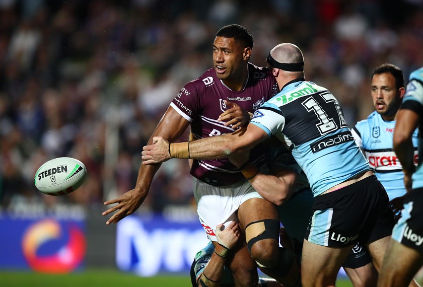 Sheer strength...Taniela Paseka offloads against the Sharks at 4 Pines Park in round 11.