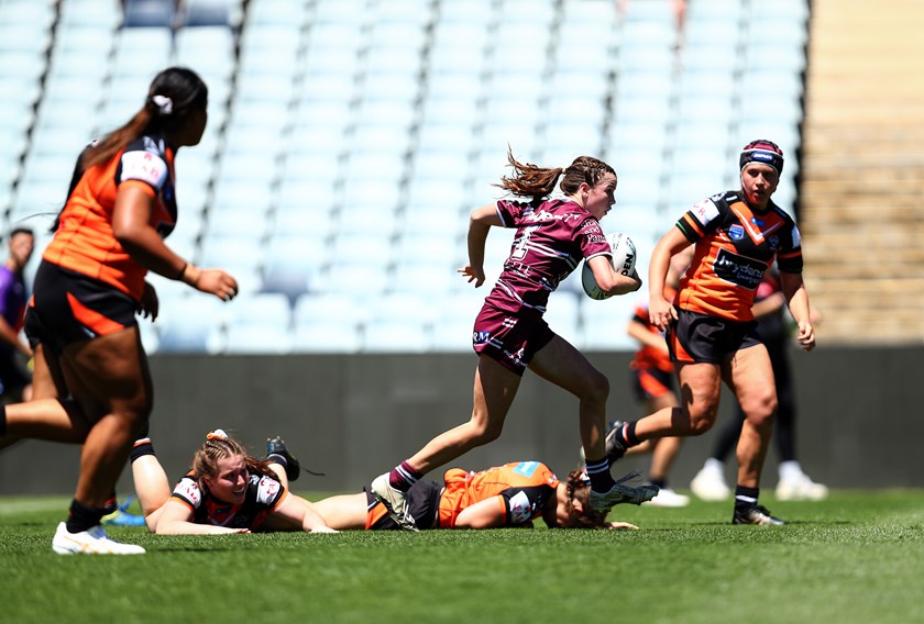 Open space...exciting full-back Chelsea Smyth scatters the Tigers
