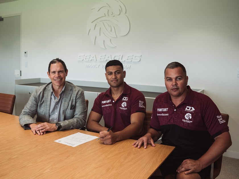 Taking care of business...Haumole Olakauátu  signs his new deal alongside Manly CEO Tony Mestrov (left) and Coach Anthony Seibold