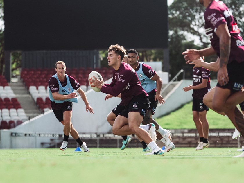 New surrounds....Bailey Hodgson (with ball) has hit the ground running at the Sea Eagles