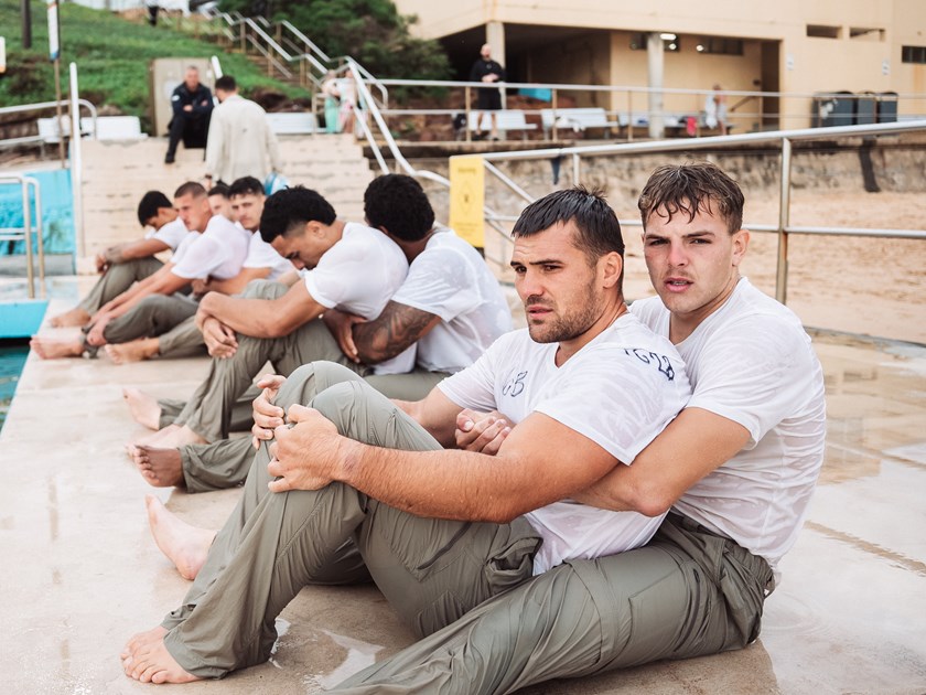 Mateship....Bailey Hodgson tries to keep warm with team-mate Kobe Rugless  at the Manly Mentality camp
