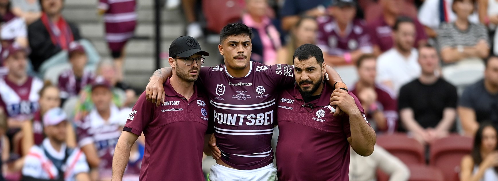 Tommy Talau leaves the field with an ankle injury