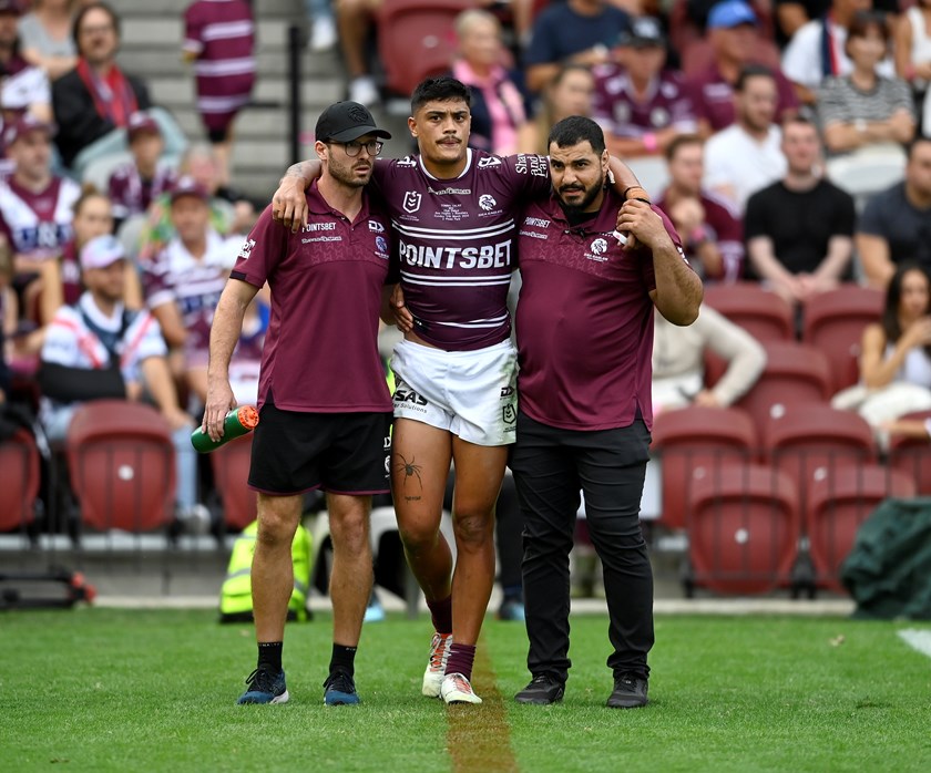 Tommy Talau leaves the field with an ankle injury