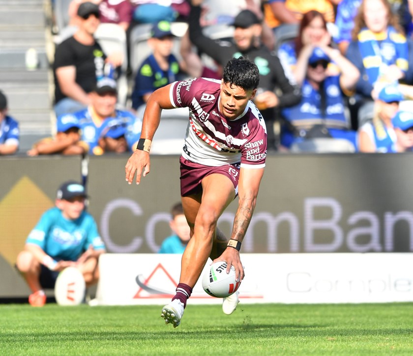 Over he goes...Manly winger Jaxson Paulo scores against the Eels