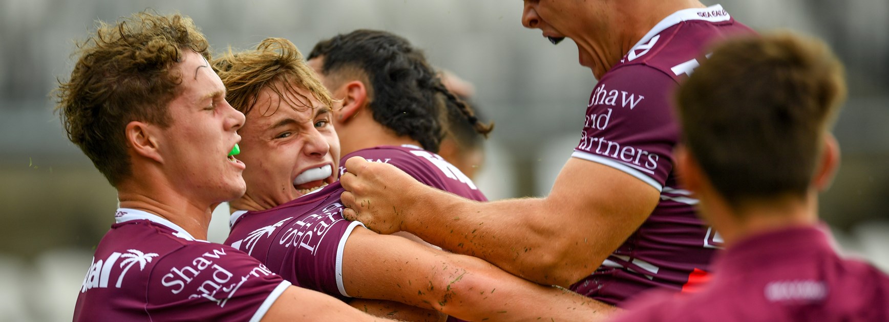 How good...the Sea Eagles celebrate one of their five tries against the Dragons