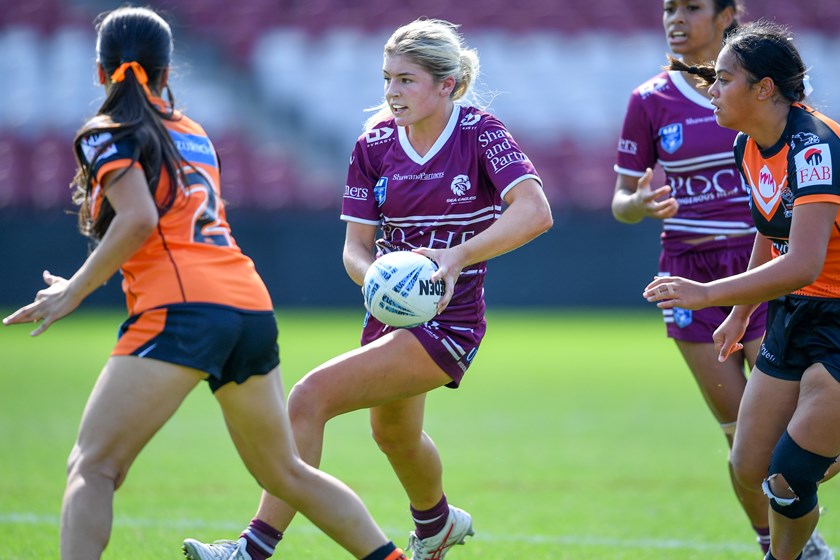 Tough one...the Sea Eagles look for a gap through the Tigers defence 