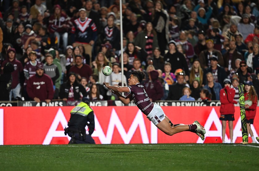 Out of here...Christian Tuipulotu punches the ball dead to seal victory over the Roosters.