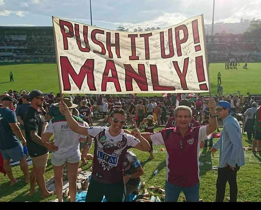 Happy times....Jake and his father, Joe, share the 'Push It Up Manly' sign at Brookvale Oval