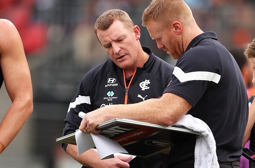 Aaron Greaves with Carlton coach Michael Voss