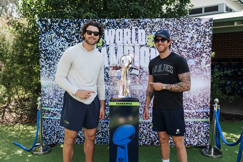 Tight end AJ Barner and Aussie punter Michael Dickson with the Lombardy Trophy