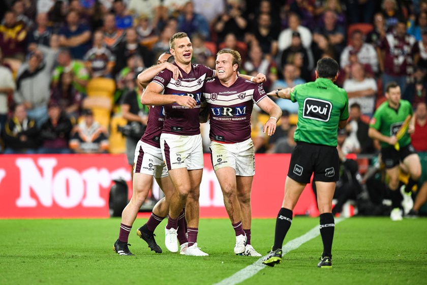 Jake celebrates a try with brother Tom in Manly's biggest ever win over the Broncos 2021 