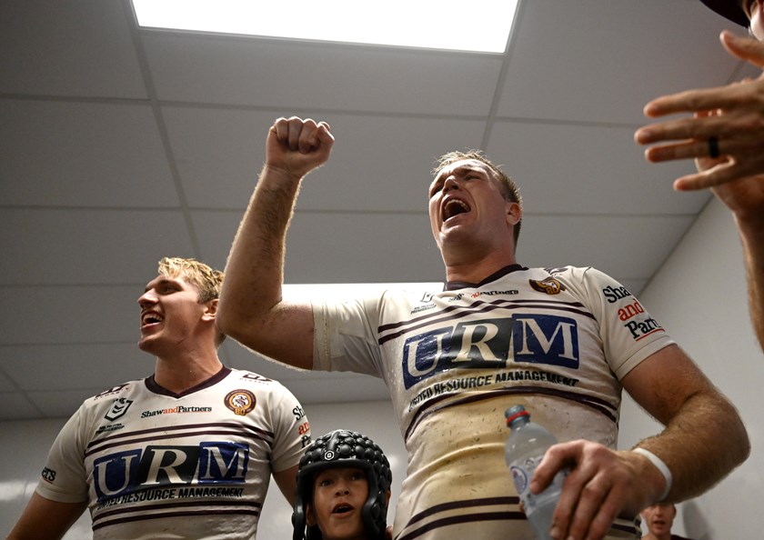 Jake, Ben and young fan SJ celebrate after Round 7 win over the Cowboys in Townsville