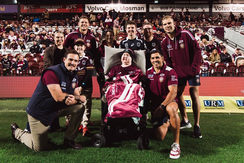 Sea Eagles players with Cam and his family at 4 Pines Park