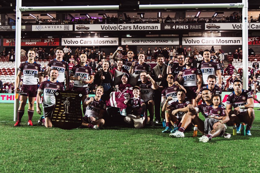 Cam and his family with the team at 4 Pines Park after the Round 10 win over Brisbane.