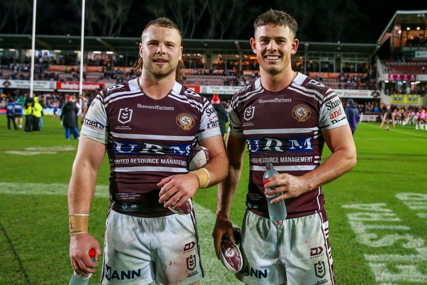 Local juniors Josh Feledy and Joey Walsh celebrate Manly's Round 17 victory over Melbourne Storm