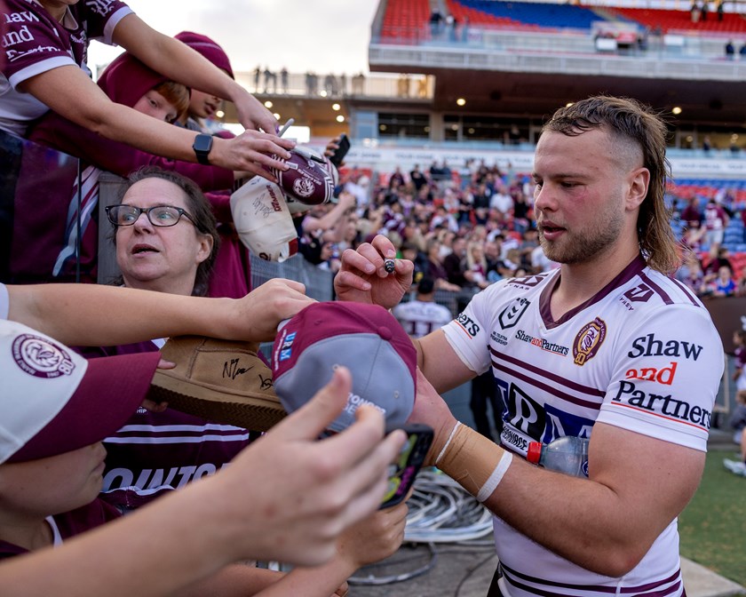 Hat-trick hero Josh Feledy with delighted Manly fans after last weekend's win in Newcastle